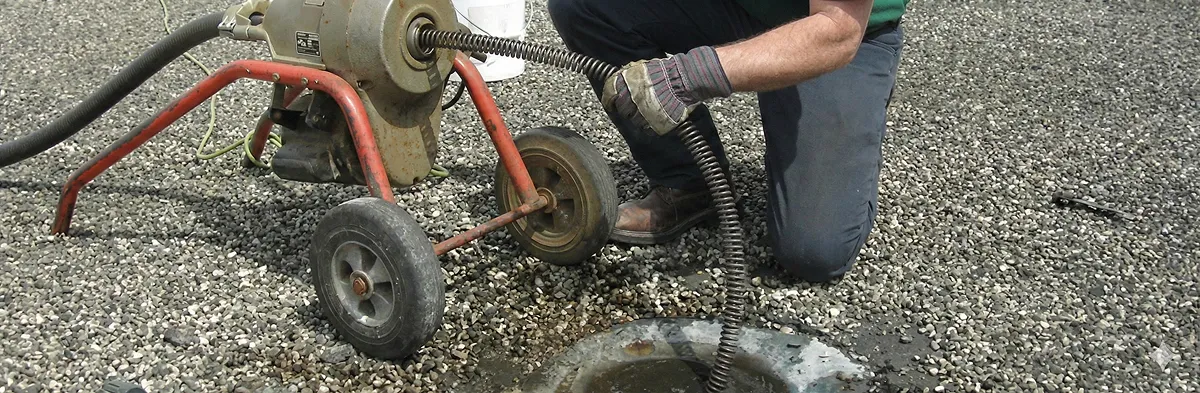 sewer rodding technician actively removing blockages from a sewer line in Green Bay, WI