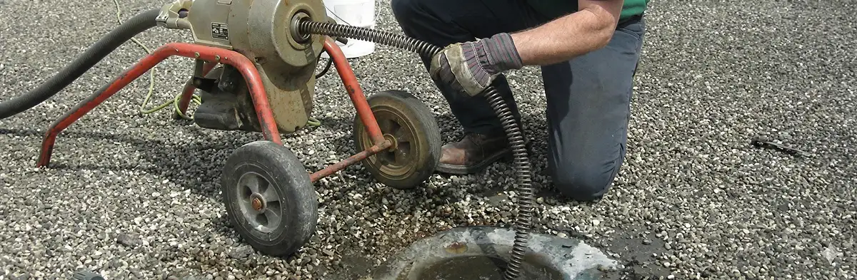 sewer rodding technician actively removing blockages from a sewer line in Green Bay, WI