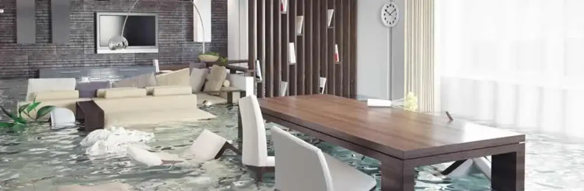 home interior affected by water damage with flooded floors and displaced furniture in Green Bay, WI